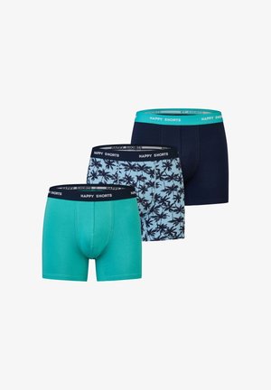Three pairs of boxer shorts: one solid teal, one patterned with palm trees on a light blue background, and one solid navy, each featuring a contrasting waistband.