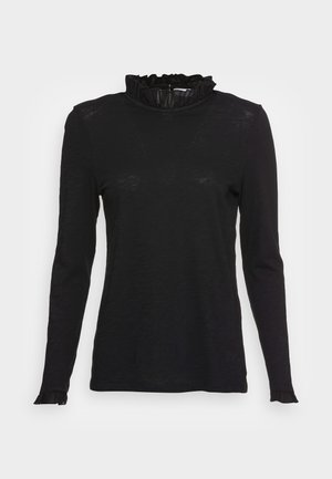 Top negro de manga larga con un cuello alto y volantes, y puños ligeramente acampanados, que presenta una tela suave y texturizada y un corte ajustado.