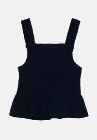 Námořnická modrá blůza se zdrsněnou texturou, širokými ramínky a rozšířeným spodním lemem. Vyrobena z jemné tkaniny s nařaseným detailem u výstřihu.