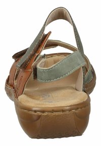 Brown and green leather sandal with a cushioned insole, adjustable straps, and a rounded toe. Textured upper and sturdy sole.
