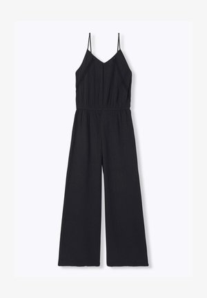 Combinaison noire sans manches avec fines bretelles, encolure en V, taille élastique et pantalon à jambes larges sur fond clair uni.