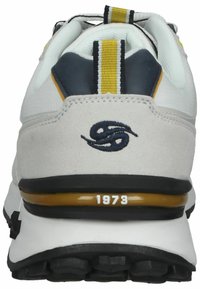 White and grey sneaker with a slip-resistant black sole, padded collar, yellow and navy accents, and "1973" embossed on the heel.