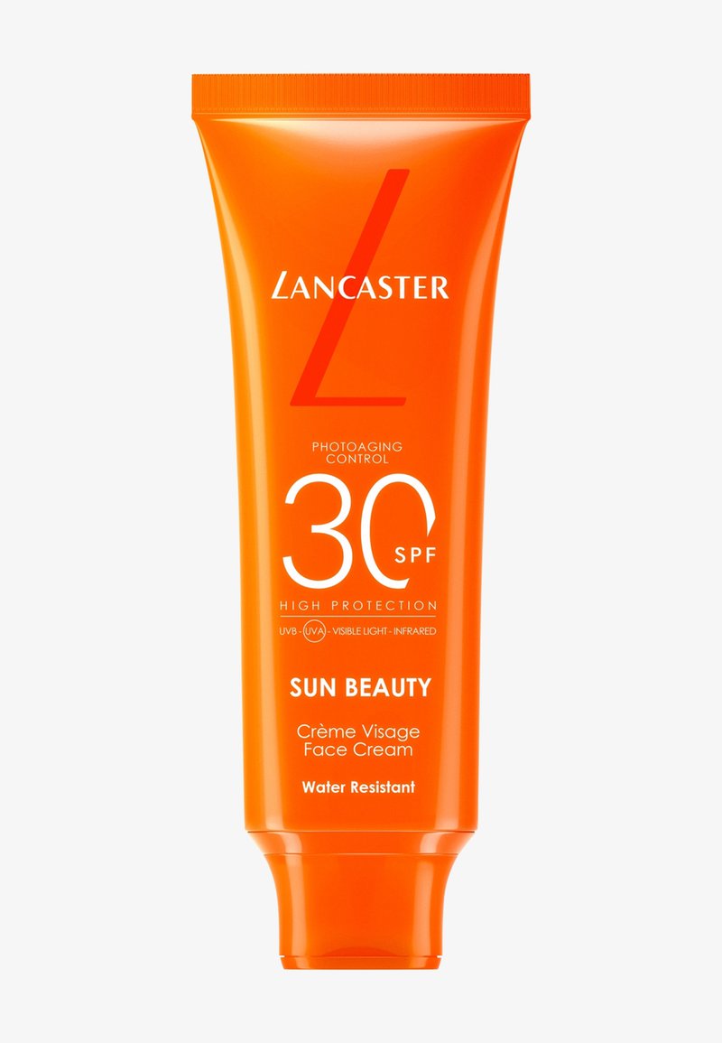 Oransje tube med Lancaster Sun Beauty ansiktskrem med SPF 30, som gir høy beskyttelse, vannmotstand og kontroll mot fotoaldring.