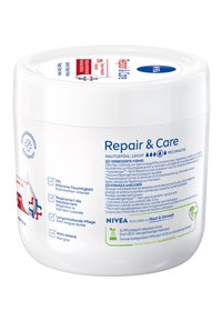 White round container with a smooth surface, labeled "Repair & Care," featuring blue accents and various text details.
