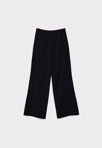 Pantalon noir à jambes larges avec taille élastique, coupe décontractée, posé à plat sur un fond gris clair.