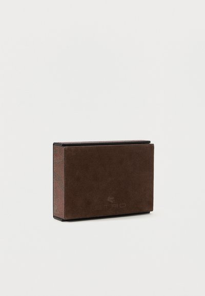 Brown suede rectangular wallet with subtle embossed logo and patterned fabric sides, shown against a white background.