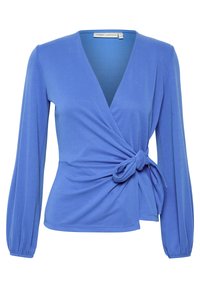 Blå omslagsblus i mjukt, stretchigt material. Har en djup urringning, långa puffärmar och en sidoknytdetalj.