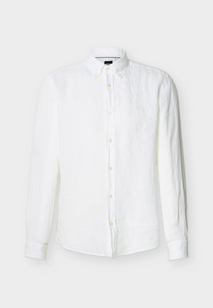 Meeste valge pika varrukaga triiksärk, millel on nööpnööpidega krae ja rinnal peenelt tikitud logo.