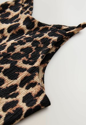 Leopardmönstrad ärmlös topp i texturerad tyg, med en svart och beige färgskala som har framträdande mönsterdetaljer och utskärningsdesign.