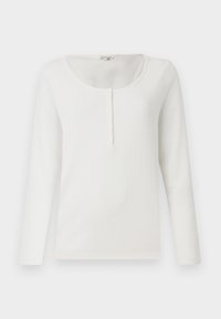 Witte geribde langemouwen top met een ronde halslijn en een gedeeltelijke knopenlijst. Zachte textuur, aansluitend ontwerp en minimalistische stijl.