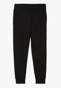 Svarta sweatpants i mjukt tyg, med elastisk midja, två sidofickor och avsmalnande ärmslut.