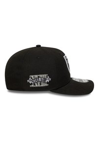 Black baseball cap with a curved visor, featuring embroidered "Super Bowl" lettering and decorative accents on the side.