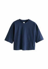 Camiseta recortada de manga corta de gran tamaño en azul marino con cuello redondo y corte holgado sobre un fondo blanco.