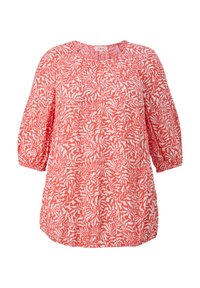 Blouse à motifs rouges et blancs, avec un col rond, des manches trois-quarts et un détail froncé à l'ourlet, réalisée en tissu léger.