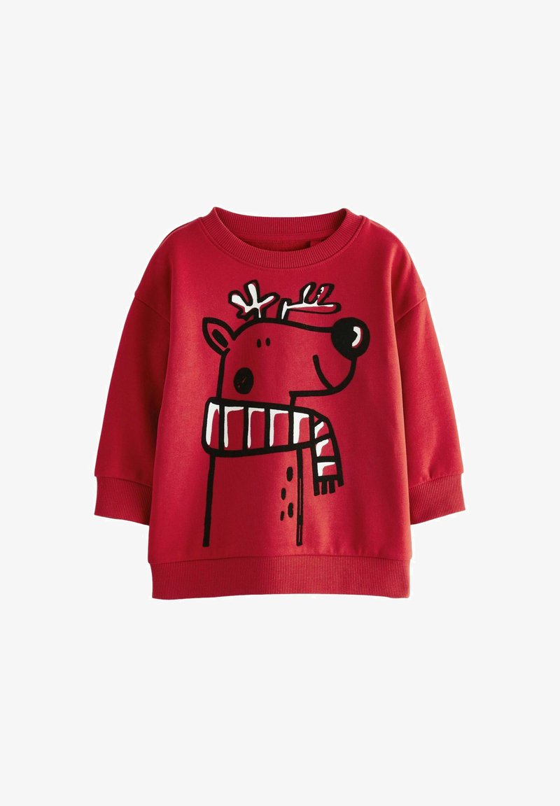 Red sweatshirt featuring a large black and white reindeer graphic with antlers and a striped scarf. Made of soft fabric with ribbed cuffs.