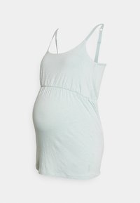 Top de maternidade verde-claro com alças finas, corpete ajustado, cintura franzida e textura suave. Adequado para uso durante a gravidez.