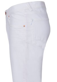 White denim jeans with copper rivets and stitching details. Features a standard waist, five-pocket design, and a single blue accent stitch.