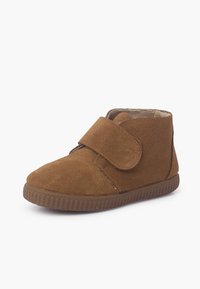 Brown suede toddler shoe with hook-and-loop strap and textured rubber sole, viewed at an angle on a white background.