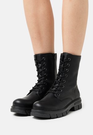 Lace-up ankle boots - schwarz