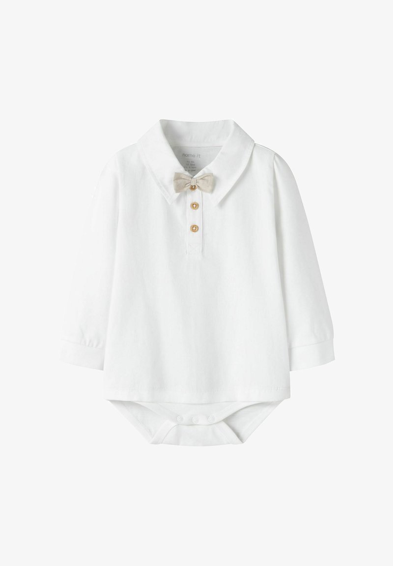 Body à manches longues blanc avec col, nœud papillon beige et trois boutons en bois au niveau du cou. Fermeture pressionnée en bas.