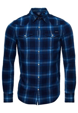 Chemise pour homme à manches longues, bleue à carreaux, avec boutons pression et deux poches poitrine à rabats.