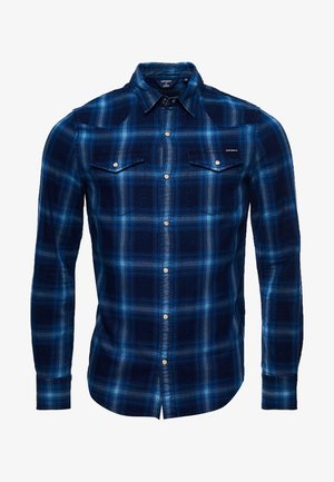 Miesten sinitarkkuinen ruutupaita, jossa pitkät hihat, pystykaulus, nepparikiinnitys ja kaksi rintataskua läpillä.