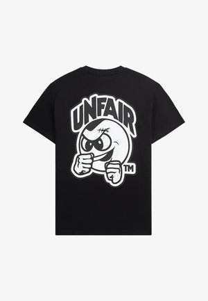 Black T-shirt with a bold graphic of an angry cartoon face with fists raised and the word "UNFAIR" above it in large letters.