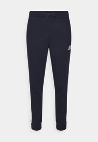Marina sweatpants med dragsko i midjan, elastiska manschetter och sidostrimlor. Tillverkade av mjukt material med en Adidas-logotyp på det övre vänstra benet.