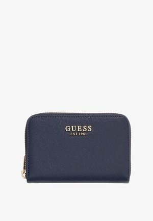 Granatowy portfel Guess na zamek błyskawiczny z teksturowaną powierzchnią i złotym logo "GUESS EST 1981" z przodu.