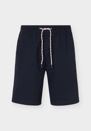 Short de bain bleu marine avec taille élastique et cordon blanc à pois noirs, longueur genou, à plat sur fond blanc.