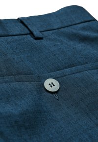 Dark blue textured fabric with a button detail. Features a flat front and subtle woven pattern, emphasizing a smooth finish.
