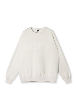 Hvid sweatshirt med rund hals og "10 DAYS" broderet på fronten. Blødt materiale, ribstrikkede manchetter og kant, afslappet pasform. Minimalistisk design.