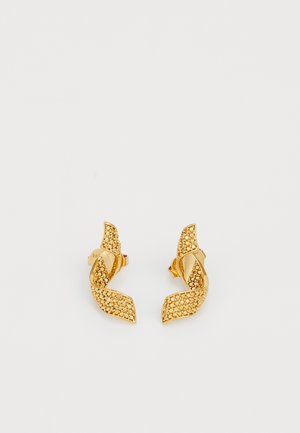 Gold-tone earrings featuring a twisted leaf design, adorned with small sparkling stones, and secured with a post back.
