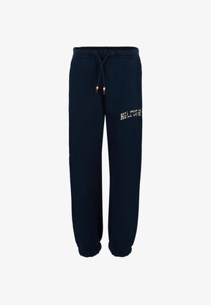 Marineblauwe katoenen joggingbroek met een elastische tailleband, aantrekkoord en ribgebreide boorden. "HILFIGER" logo in beige aan de zijkant.