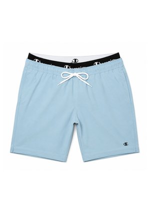 Lyseblå badeshorts med sort elastik i taljen med hvide "Champion"-logoer, hvid snor foran og lille Champion-logo på venstre ben.