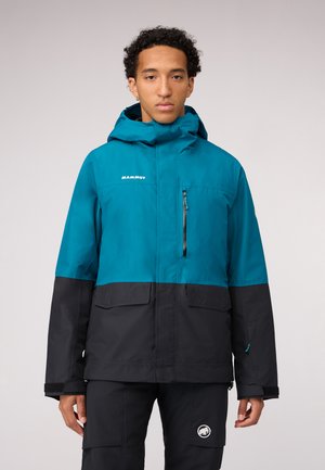 Tropfengrüne und schwarze wasserdichte Jacke mit einer Reißverschlusstasche auf der Brust, zwei Fronttaschen, verstellbarem Kapuze und kontrastierenden Farben.