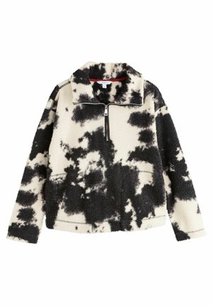 Fleece-pullover i svart och kräm med en ko-print, dragkedja i halsen, ficka med dragkedja och mjuk textur. Har en ståkrage och elastiska muddar.