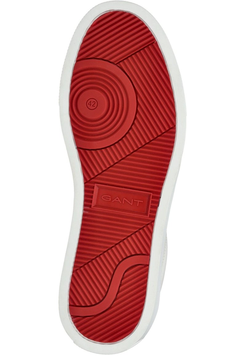 Gummisula i röd färg med texturerat mönster, som har cirkulära och ribbade designer, samt en vit kant. Storleksindikator 42 präglad.