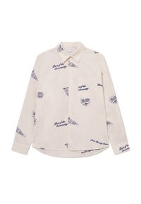 Light beige long-sleeve shirt with navy blue graphic designs and text. Features a button-down collar and a chest pocket. Cotton fabric.