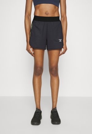 Shorts sportivi neri con una ampia cintura elastica, dettagli verdi laterali e una discreta decorazione del logo sul davanti. Tessuto leggero.