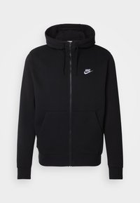 Schwarze Zip-Hoodie aus weichem Stoff, mit einer vorderen Tasche, verstellbare Kapuze mit Kordelzügen und weißem Nike-Logo auf der Brust.
