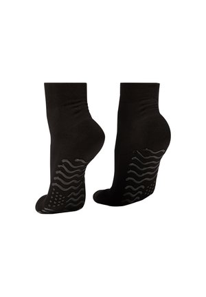Black ankle socks with a textured silicone grip pattern on the soles, smooth material, and a snug fit around the ankle.