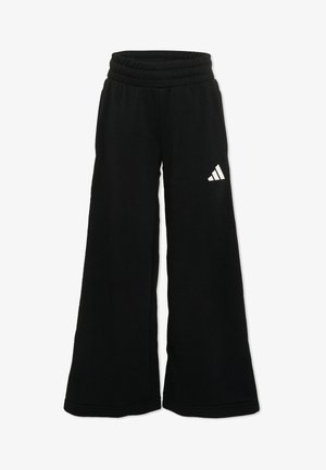 Zwarte sweatpants met wijde pijpen, elastische tailleband en wit Adidas-logo op de bovenste linker dij.