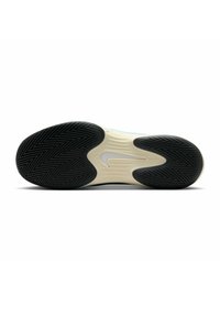 Nike-Schuhsohle mit einer schwarzen Gummiaußensohle im Fischgrätmuster, weißen Details an der Zwischensohle und einem glatten, abgerundeten Fersendesign.
