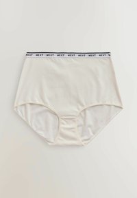 Culottes blanches taille haute avec une bande élastique noire et blanche répétant le mot « NEXT », posées à plat sur un fond neutre.