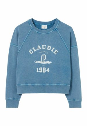 Felpa blu con maniche raglan, dotata di una grafica testuale bianca che recita "CLAUDIE SERENDIPITY CP 1984." Materiale in cotone morbido e testurizzato.