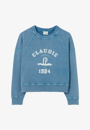 Felpa blu con maniche raglan, dotata di una grafica testuale bianca che recita "CLAUDIE SERENDIPITY CP 1984." Materiale in cotone morbido e testurizzato.