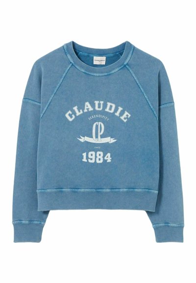 Felpa blu con maniche raglan, dotata di una grafica testuale bianca che recita "CLAUDIE SERENDIPITY CP 1984." Materiale in cotone morbido e testurizzato.