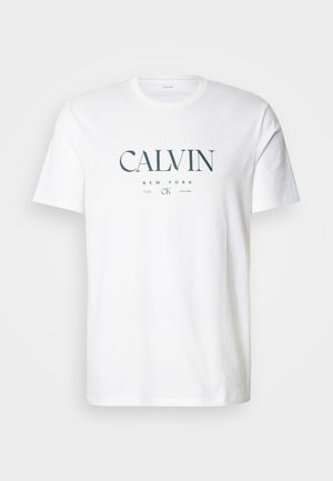 Valge puuvillane t-särk, millel on graafiline kujundus tekstidega "CALVIN", "NEW YORK" ja "1968" tumerohelises värvitoonis. Ümar kaelus, lühikesed varrukad.