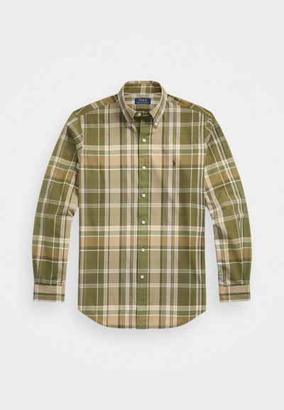 Πουκάμισο με μακριά μανίκια σε καρό σχέδιο σε πράσινες και μπεζ αποχρώσεις, με στρίφωμα κουμπιάς, λογότυπο στο στήθος και καμπυλωτό στρίφωμα.
